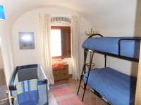 Twin bunk bedroom at Lemon Tree Terrace apartment in Bosa